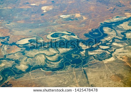 RIVERINA, NEW SOUTH WALES, AUSTRALIA: Aerial view of riverine fluvial landforms in semi-arid pastoral land on the alluvial floodplain soils associated with the Murray-Darling river system. Royalty-Free Stock Photo #1425478478