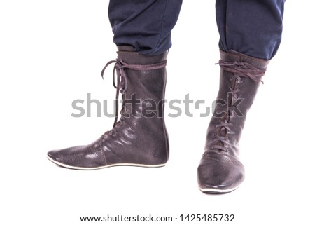 High boots, lace, leather. White background. Close up.