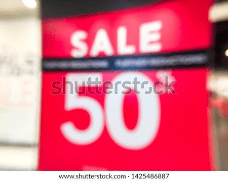 Abstract blur of sale text at the shopping mall for background.