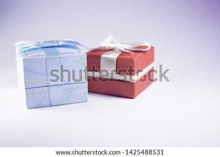blue and red gift boxes with jewelry