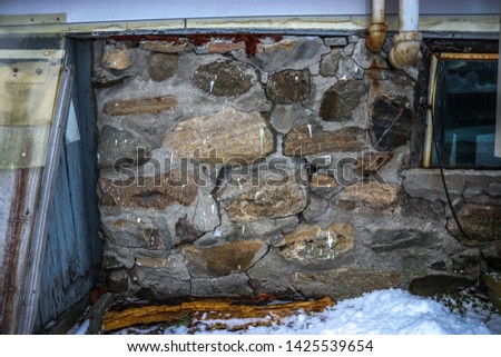 Old Stone Foundation of Home Royalty-Free Stock Photo #1425539654