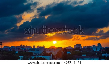 Sun shining over Miami on a cloudy sunset. Southern Florida, USA