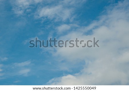 Bright sky and fluffy white clouds