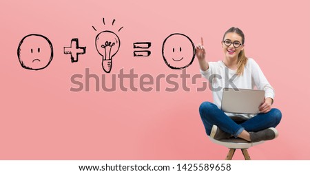 Good idea equals happy with young woman using her laptop