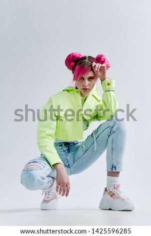 woman with pink hair sitting sneakers fashion style