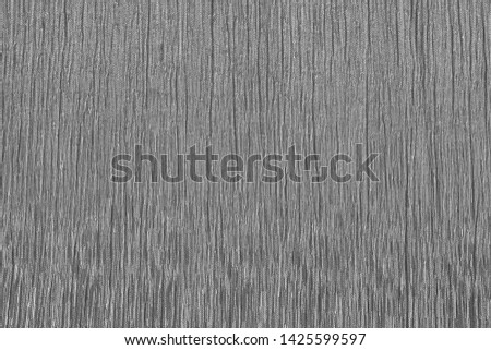 Silver matt textured cloth background with vertical creased pattern