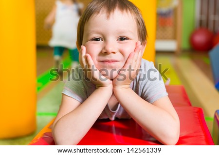 Cute little girl portrait in daycare gym