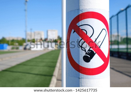 Non-smoking signs in public park. 