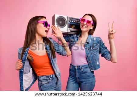 Close up photo beautiful buddies she her best models ladies chill mood hands arms v-sign listen favorite playlist vintage recorder wear jeans denim jackets blazers isolated bright pink background