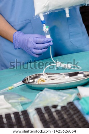 Nurse preparing medication for parenteral nutrition in a hospital, conceptual image Royalty-Free Stock Photo #1425626054