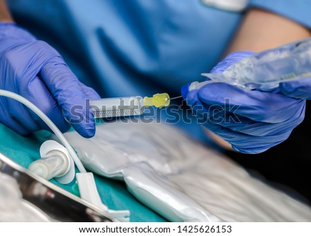 Nurse preparing medication for parenteral nutrition in a hospital, conceptual image Royalty-Free Stock Photo #1425626153