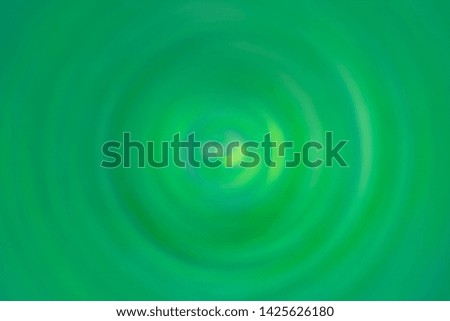 Abstract vivid color and movement background from blurred droplet on green water surface. 