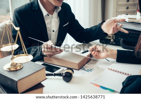 Businessman and lawyer discuss the contract document. Treaty of the law. Sign a contract business. Royalty-Free Stock Photo #1425638771