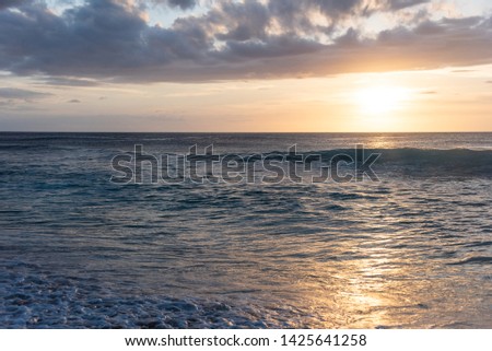 Dramatic sunset waves on the north shore of Oahu