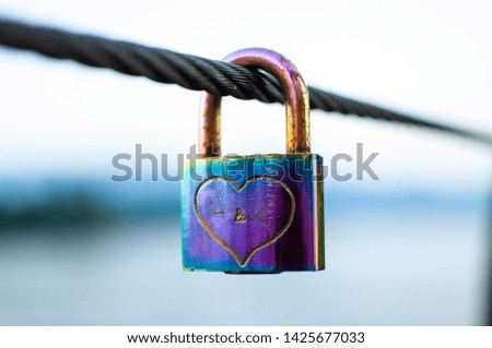 Coloured padlock with a hearth