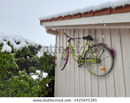 green bicycle on a white wooden background