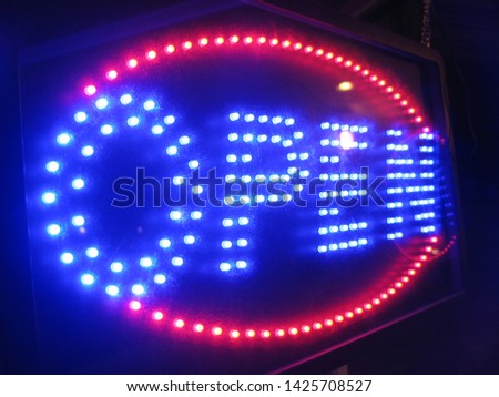 bright neon open signs shining and glowing