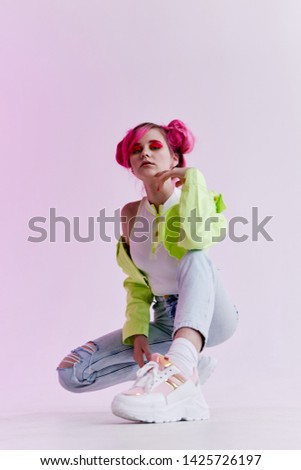 woman with pink hair in green style fashion jeans