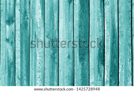 Old grungy wooden planks background in cyan tone. Abstract background and texture for design.