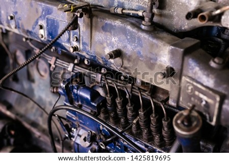 Mechanic opened the locking valve mechanism. Disassemble engine block vehicle. Old motor capital repair. Car service concept.