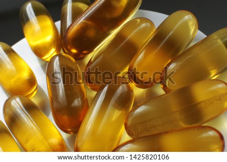 Macro photography set of pills of different colors and shapes and vitamins in capsules macro fish oil macro photo