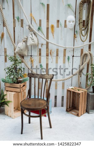mini photo Studio, old wooden chair, boxes and various attributes to create an atmosphere, a corner for photography