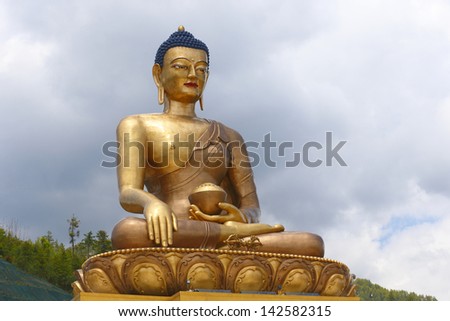 Buddha Dordenma Statue against sky background is a bronze and gold gilded statue overlooking the city of Thimphu, Bhutan. This 169 feet Giant Buddha is one of the tallest Buddhas in the world.