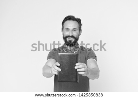 Literary critic. Man mature bearded guy hold book. Satisfied reader. Book presentation concept. Author presenting book copy space. Bestseller and book store. Literature taste and recommendations.