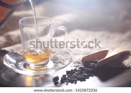 Brewed tea on a serving table with brewing
