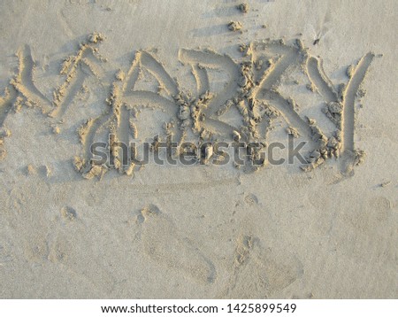 Close up view Hand writing on sand beach side with sign blank use design elemental nature. Summer spring day Form words alphabet typescript font written drawn carved note text. Spelled purpose wedding
