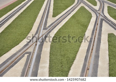 Crossing the tracks of an urban tram with artificial turf