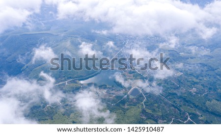 Aerial photography of villages in the mountains from the clouds