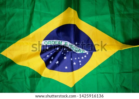 Brazilian flag kneaded - Dramatic image.