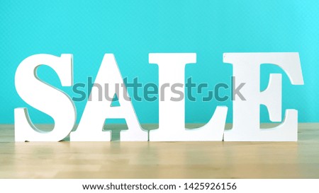 End of Financial Year sales shopping concept with large sale letters.