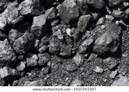 Pile of natural black hard coal for texture background. Best grade of metallurgical anthracite coals often referred to as stone coal and black diamond coal Royalty-Free Stock Photo #1425943307