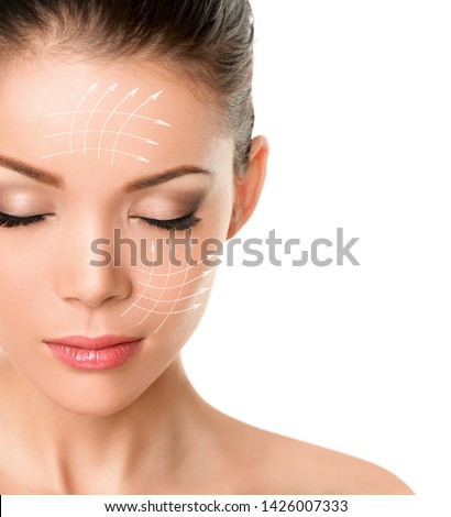 Face lift anti-aging facial treatment skin care product lifing sagging skin removing wrinkles for beauty woman. Arrow lines drawing on face. Royalty-Free Stock Photo #1426007333