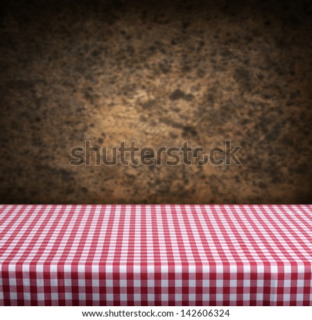 Empty table and dark brown wall in background. Great for product display montages.