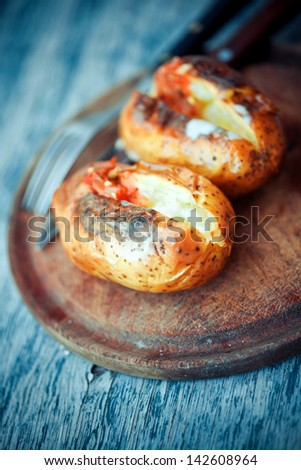 bake potato place pub food cheese setting chili eating stuffed baked potato with cheese and hot salsa bake potato place pub food cheese setting chili eating stuffed color colour cut english interior f