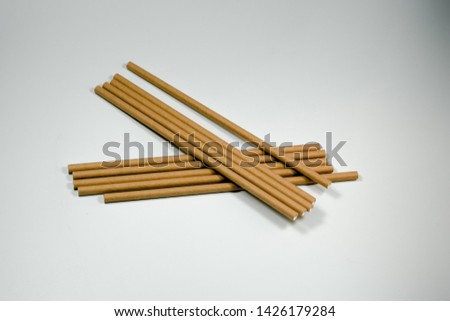 Paper Straws on Grey background for advertising and other promotional aspect