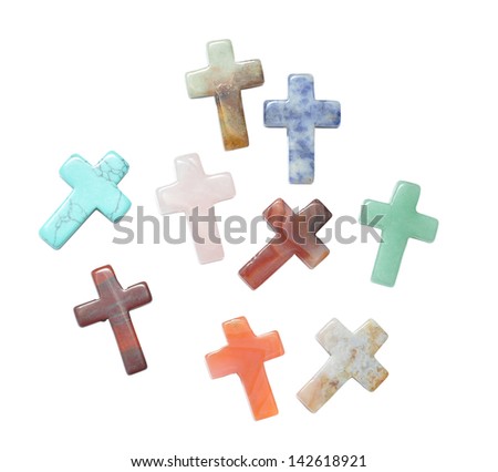 Crosses made of semi precious stones isolated on white background