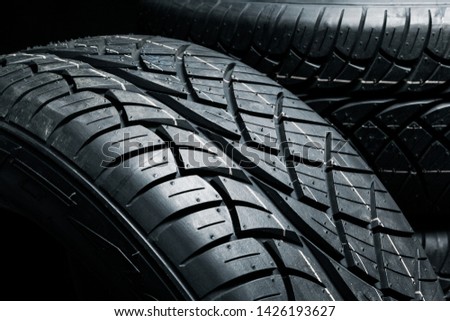 New tyres background. Car tyres close up Royalty-Free Stock Photo #1426193627