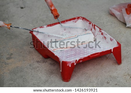 Selected focus photo of Paint Roller Brushe on the red trey