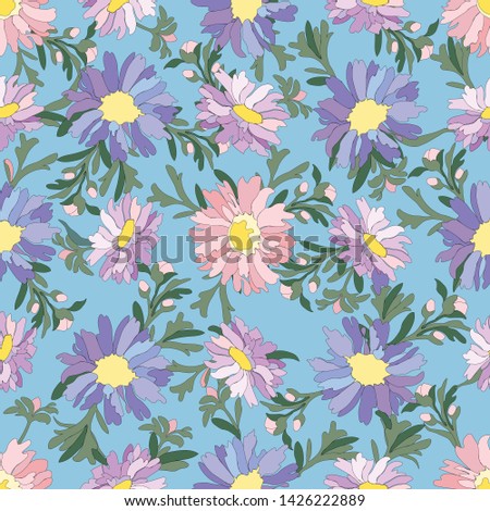 Seamless pattern of pink and blue ornamental flowers on a light blue background.