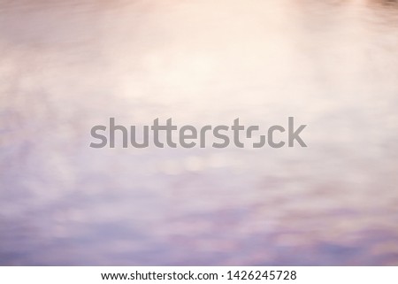 Colorful reflection of the water. Blurred background.