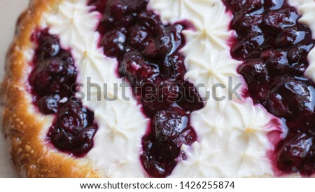 Delicious dough cake with tender curd and juicy cherry filling