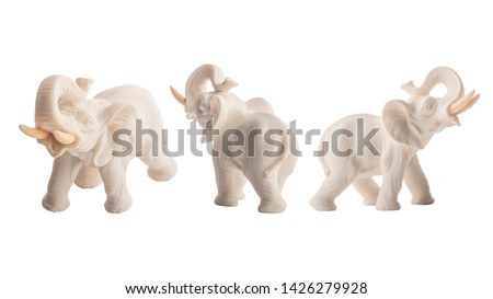 White Elephant symbol of something expensive but useless, a pointless waste. Macro shot of small figure/toy elephant isolated on 255 white background with clipping work paths included in jpeg.