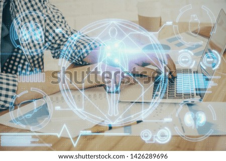 Science hologram with man working on computer on background. Concept of study. Double exposure.