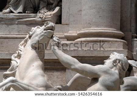 Fontana di Trevi fountain Rome statue detail on sunny day