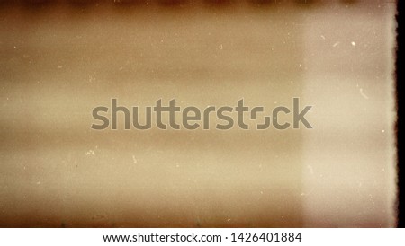 Designed film texture background with heavy grain, dust and light leak