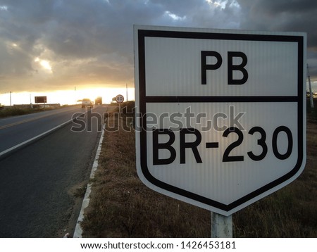 Approximate image of a white traffic sign next to a Brazilian highway, BR 230, near the municipality of Soledade, Paraíba, Brazil. Royalty-Free Stock Photo #1426453181